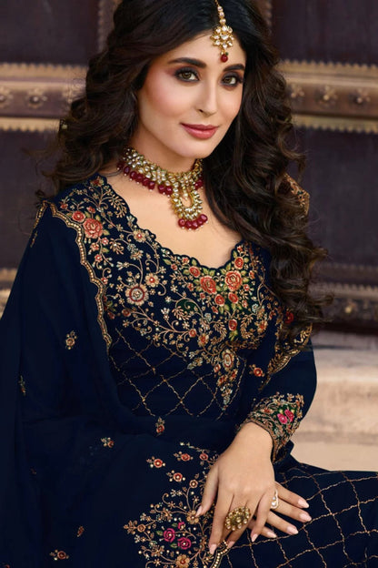 Close-up of neckline detailing on navy blue kameez