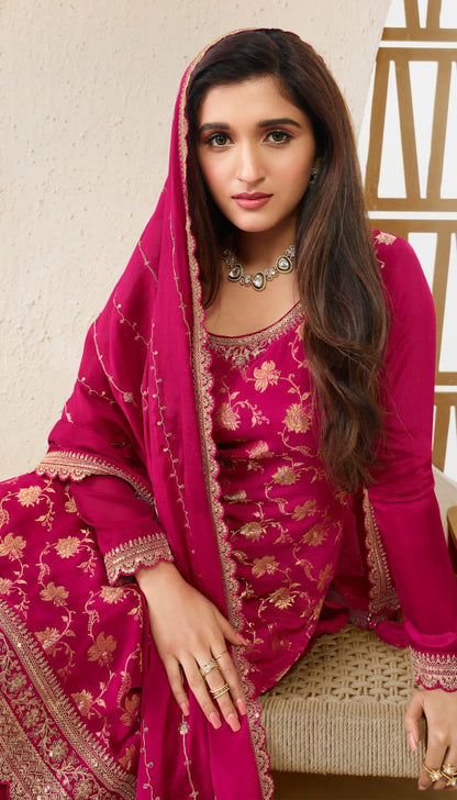 A Woman Wearing a Traditional Pakistani Salwar Kameez Dupatta Suit 