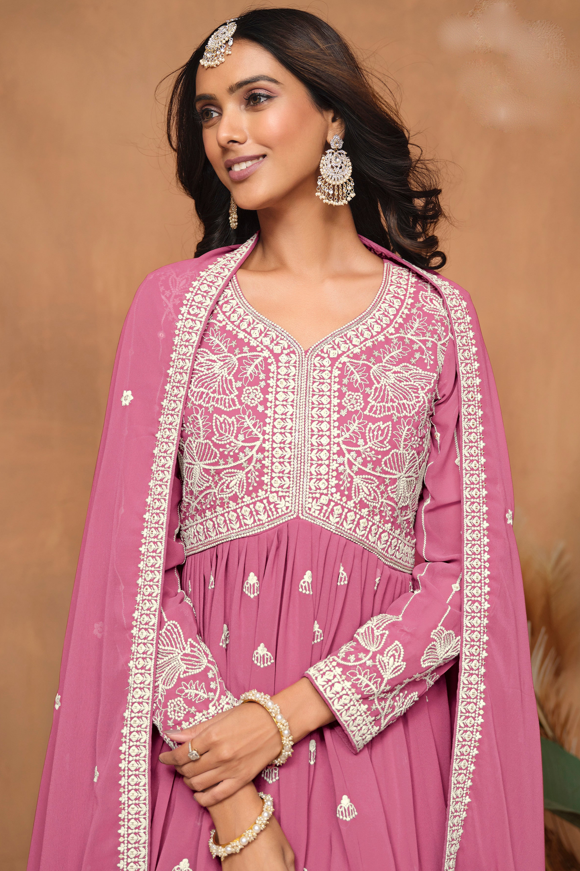 Close up of embroidery work on pink sharara outfit
