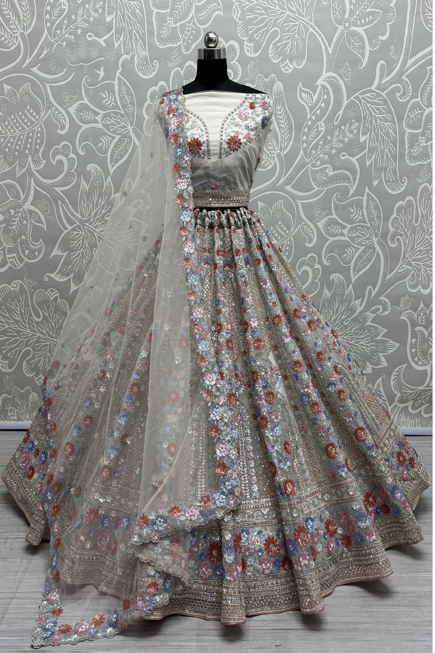 Elegant net lehenga with heavy embroidery for wedding party