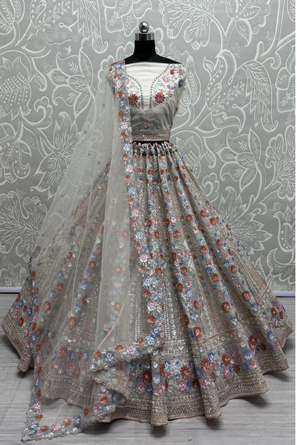 Elegant net lehenga with heavy embroidery for wedding party
