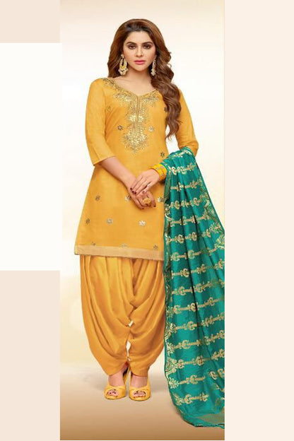 Woman wearing patiala yellow suit for haldi ceremony