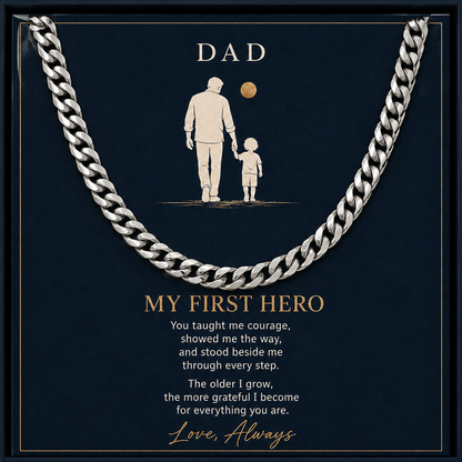 A silver-toned curb chain necklace presented on a dark navy gift card with a father-and-child silhouette illustration and sentimental text addressed to Dad.