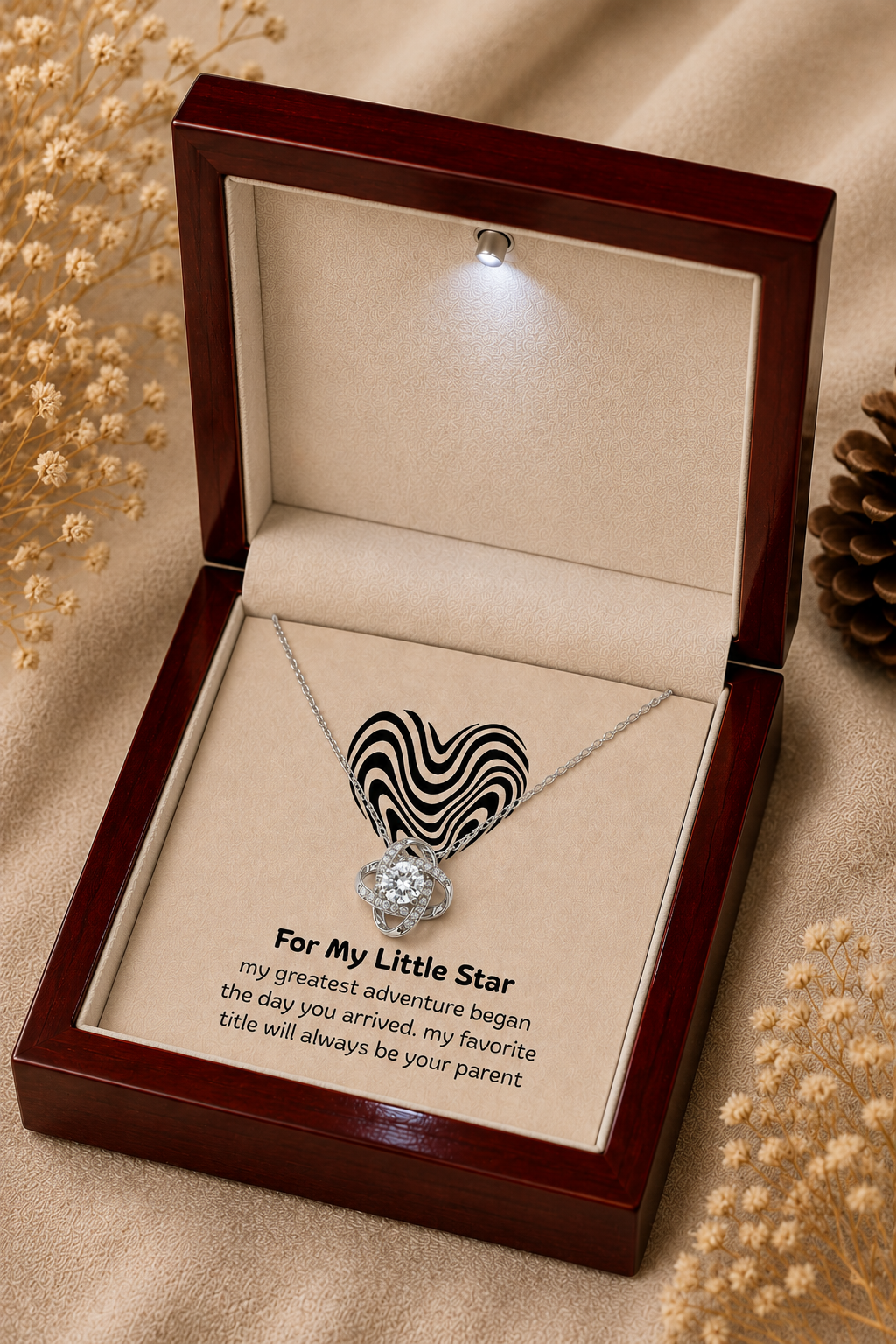 Silver-tone heart necklace with black wave design