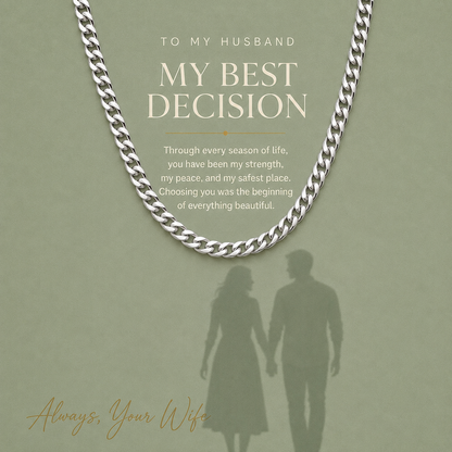 Silver chain necklace with a romantic quote for a husband and a silhouette of a couple holding hands on a sage green background.