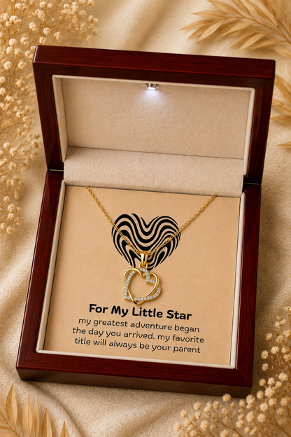 Gold-tone intertwined heart pendant with clear crystal-style accents