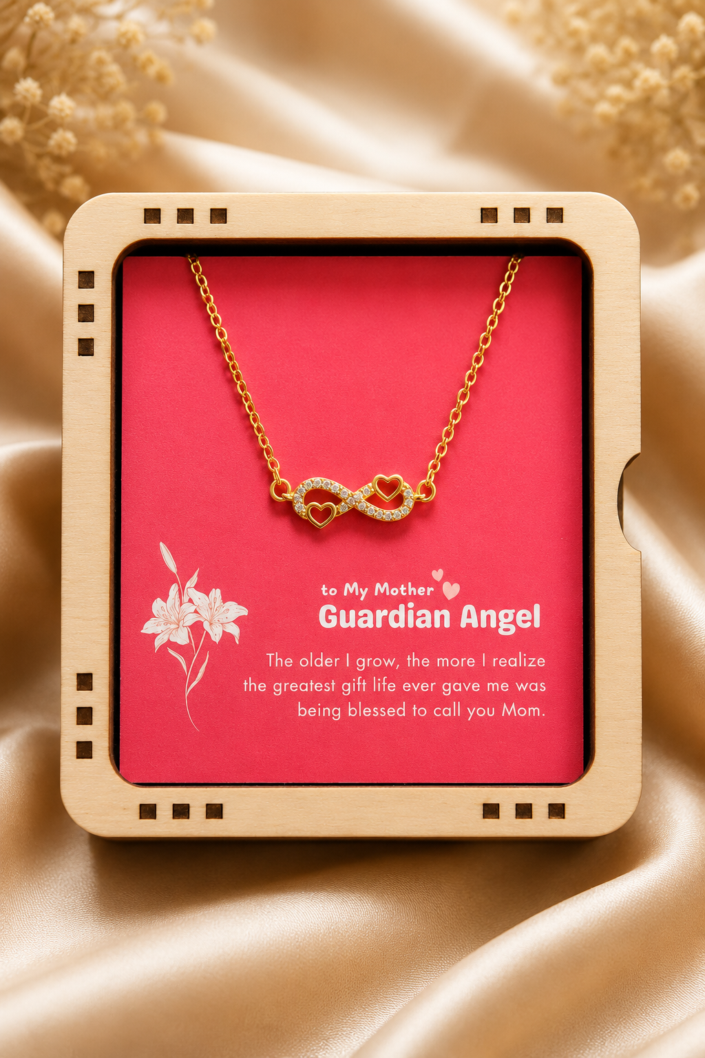 Gold-tone Mother infinity necklace displayed on red Guardian Angel card