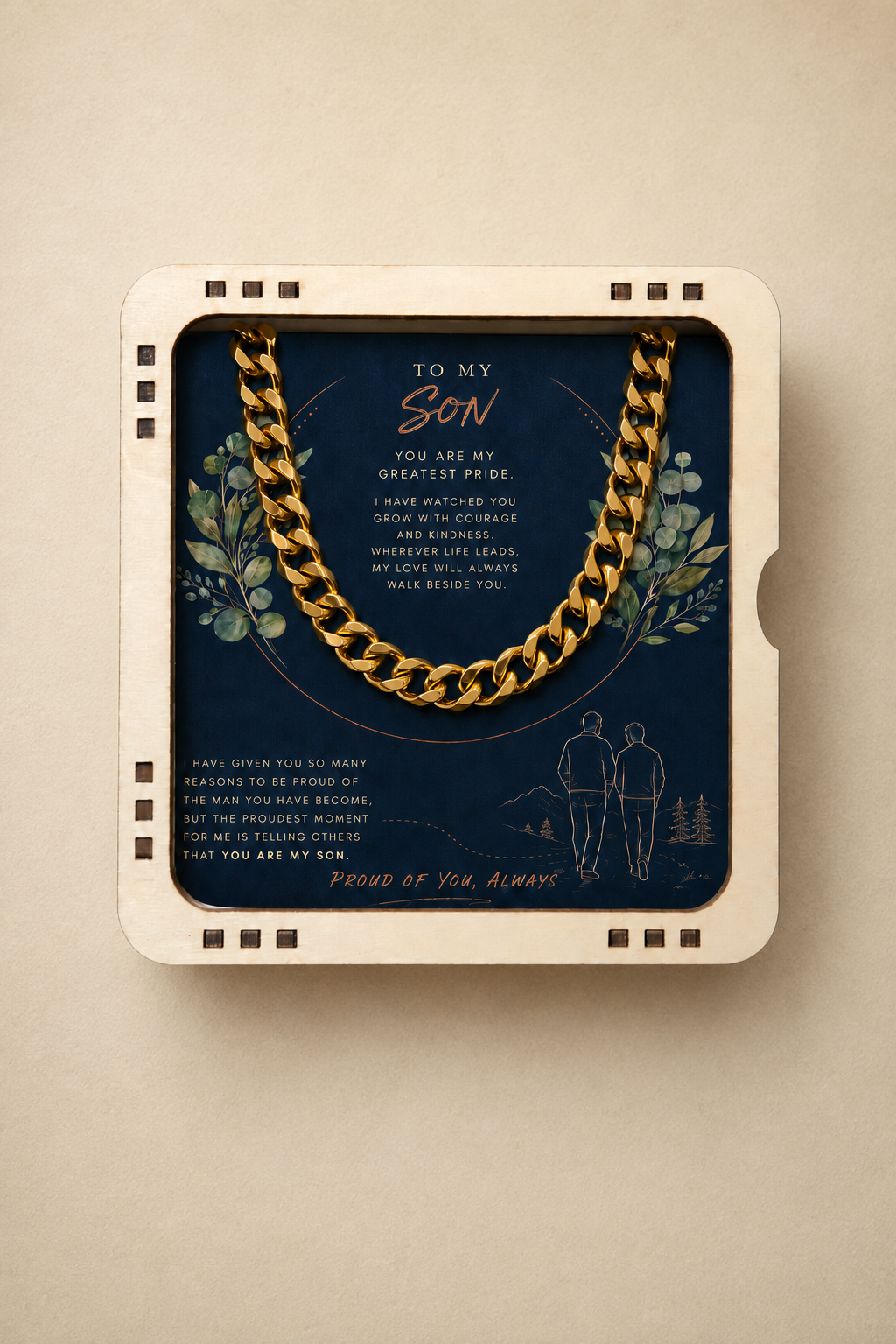 A gold chain necklace presented inside a cream-colored 