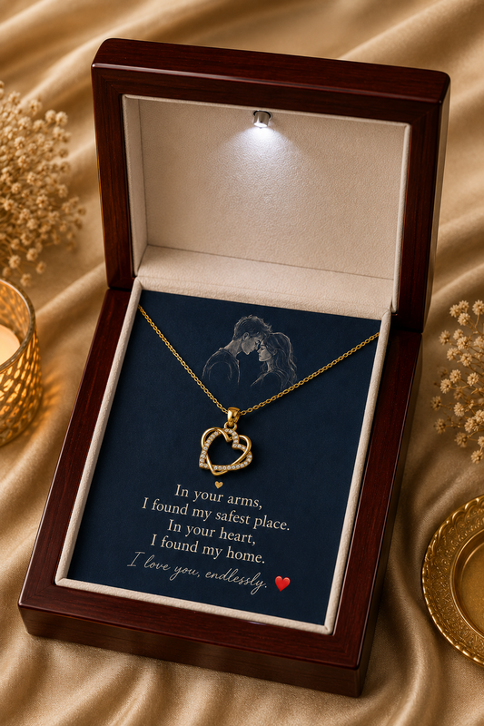Gold-tone heart necklace with clear stone accents and love message card