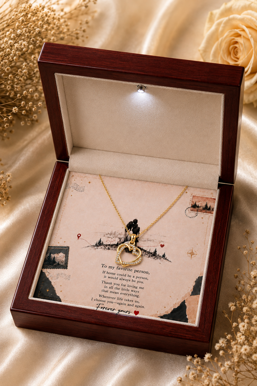 Gold-tone heart necklace with clear stone accents and love message card