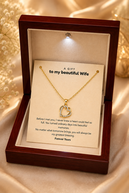 Gold-tone heart pendant necklace and emotional message card close-up