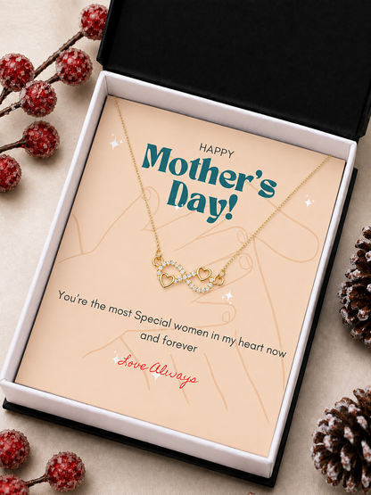 Gold-tone infinity pendant with heart accents and clear crystal-style stones
