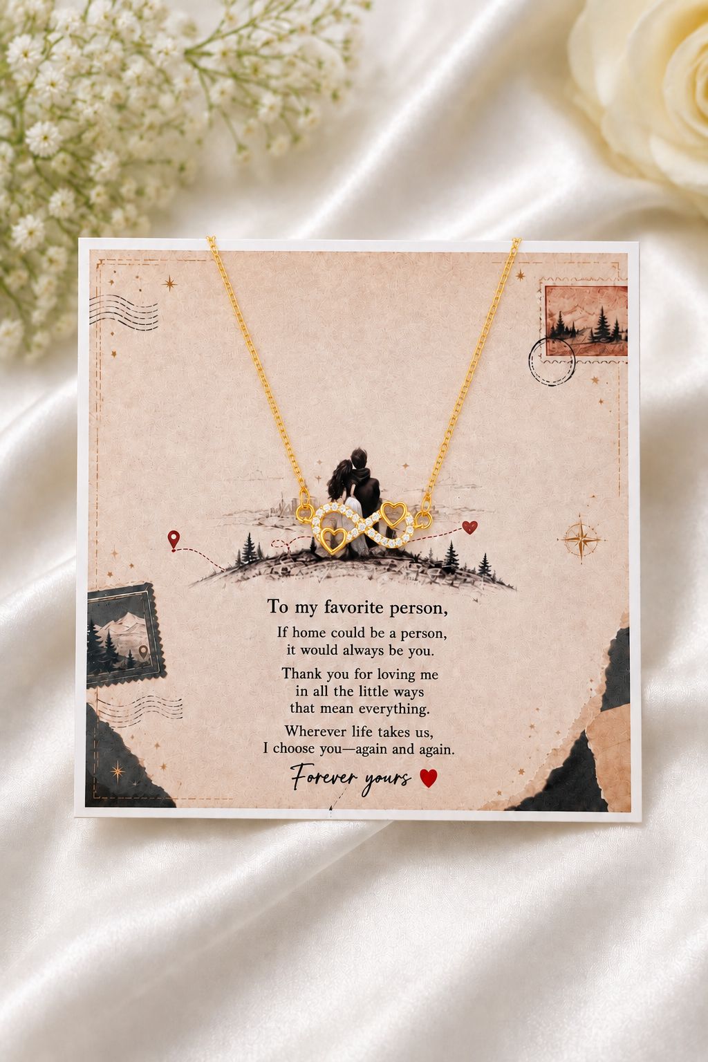 Gold-tone infinity heart necklace with clear accents and heartfelt message card