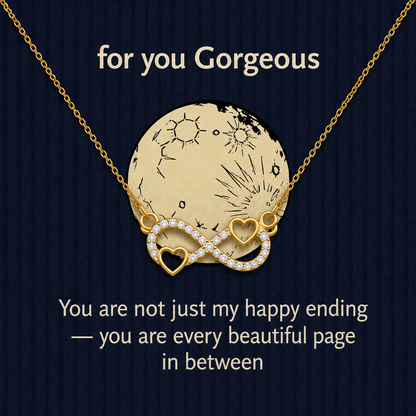 Gold-tone infinity necklace with two heart accents and clear crystal-style detailing