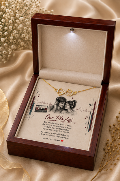 Gold-tone infinity heart necklace and message card inside premium presentation box