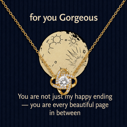Gold-tone necklace displayed on navy message card in gift box