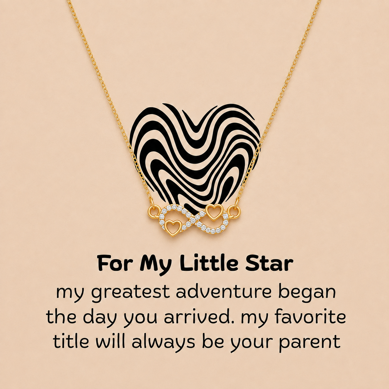Gold-tone heart infinity necklace with message card expressing a parent’s love for their little star