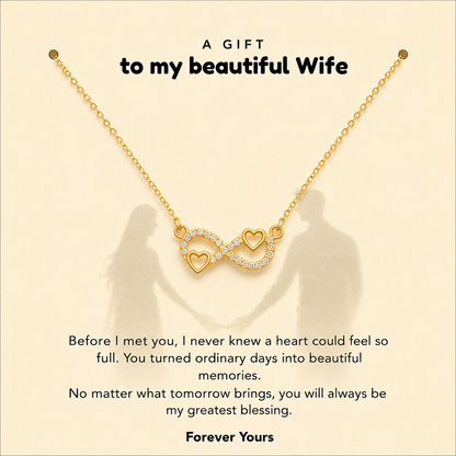 Gold-tone wife necklace featuring intertwined infinity and heart design