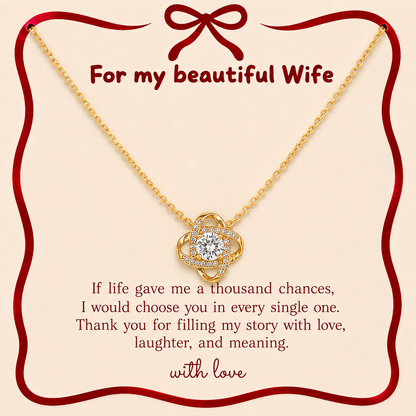 Gold-tone wife necklace with interlocking-loop pendant and clear stone