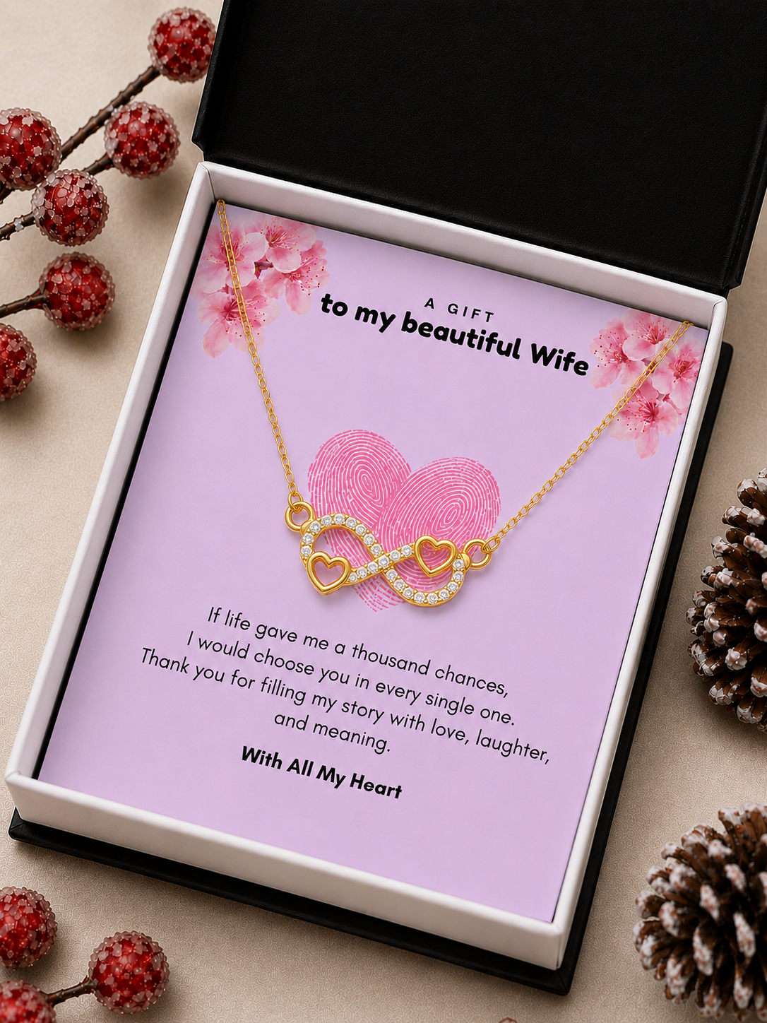 Gold-tone wife necklace featuring linked hearts and infinity design