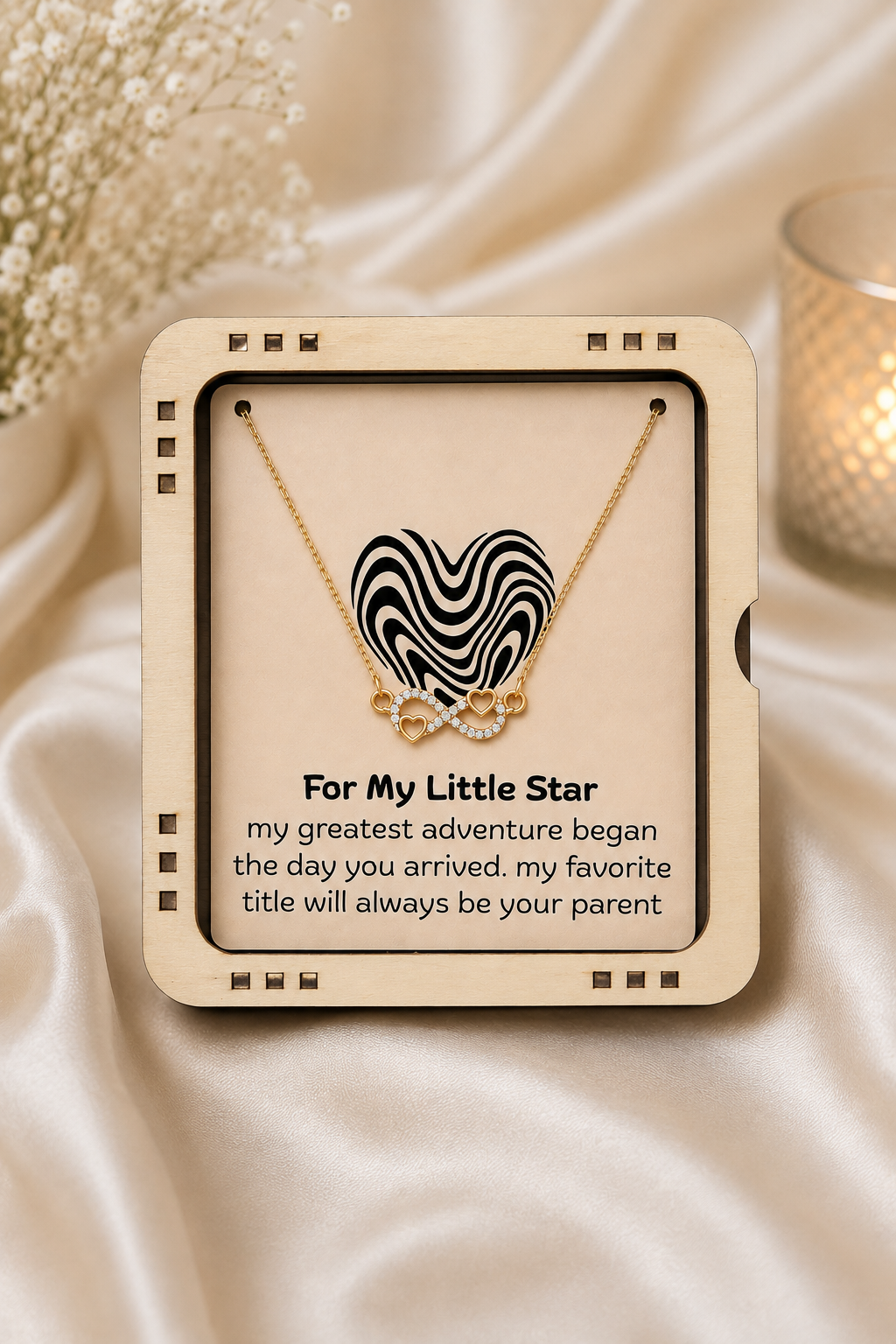Gold-tone infinity necklace with heart details and Little Star message card for a meaningful parent-to-child gift