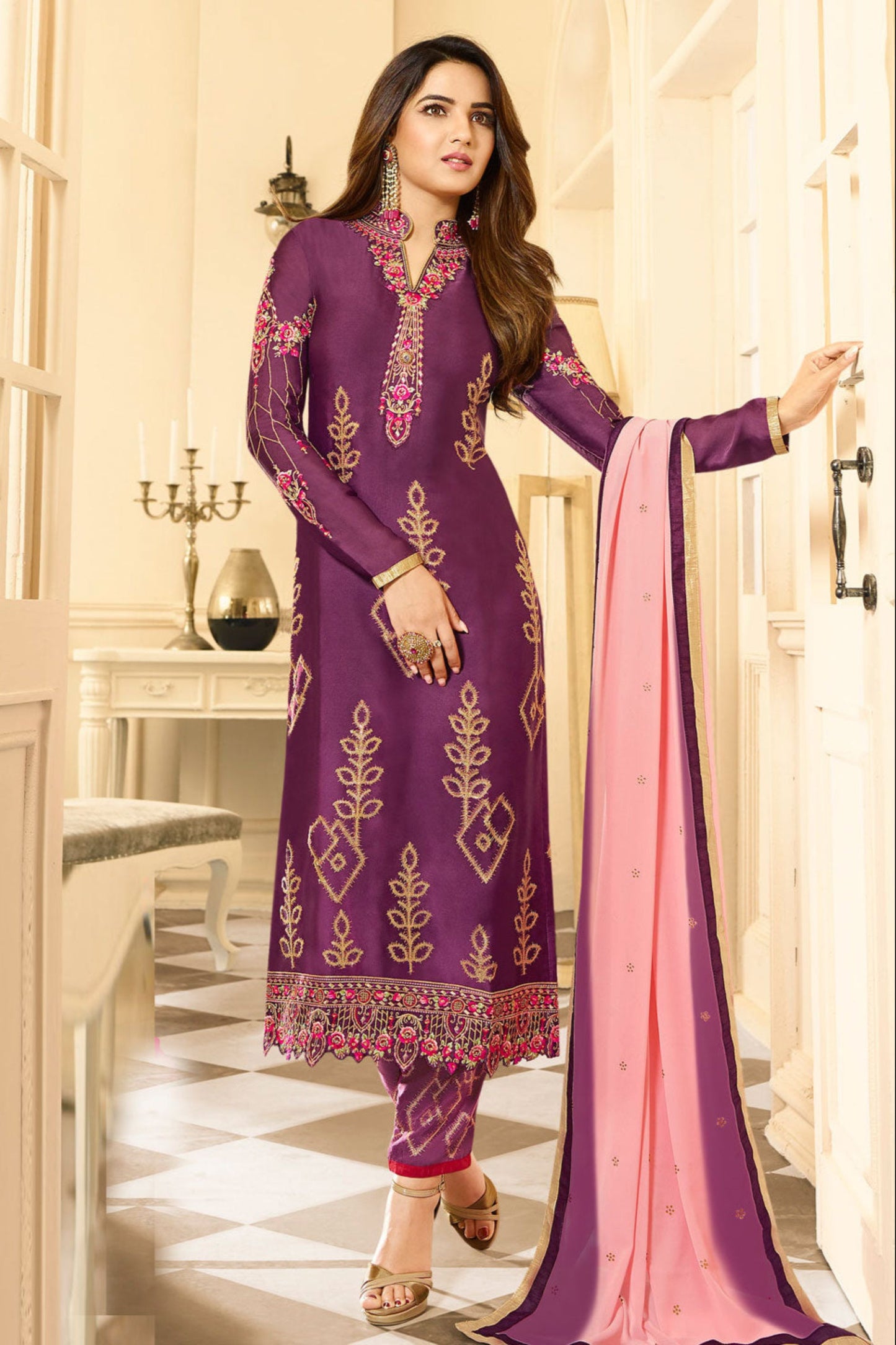 Close-up of embroidery work on purple kameez