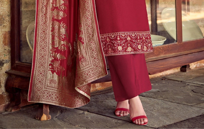 Traditional maroon salwar kameez with intricate embroidery, perfect for wedding guests.