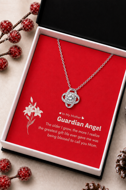 Silver-tone Mother pendant necklace displayed in wooden presentation box