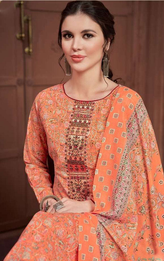 Detailed embroidery work on orange cotton wedding dress