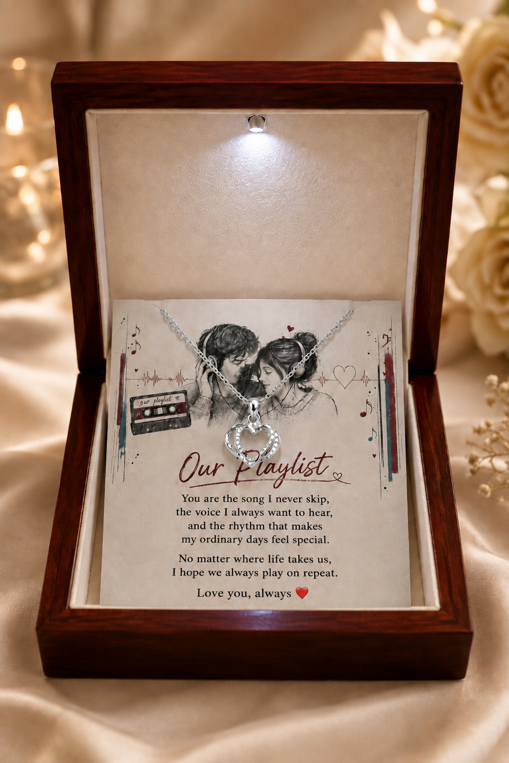 Silver-tone Our Playlist heart necklace inside a black and white gift box