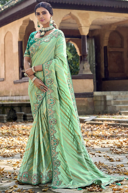 Pistachio Green Saree exudes calm elegance and freshness – ideal for weddings, Eid, or summer gatherings. 