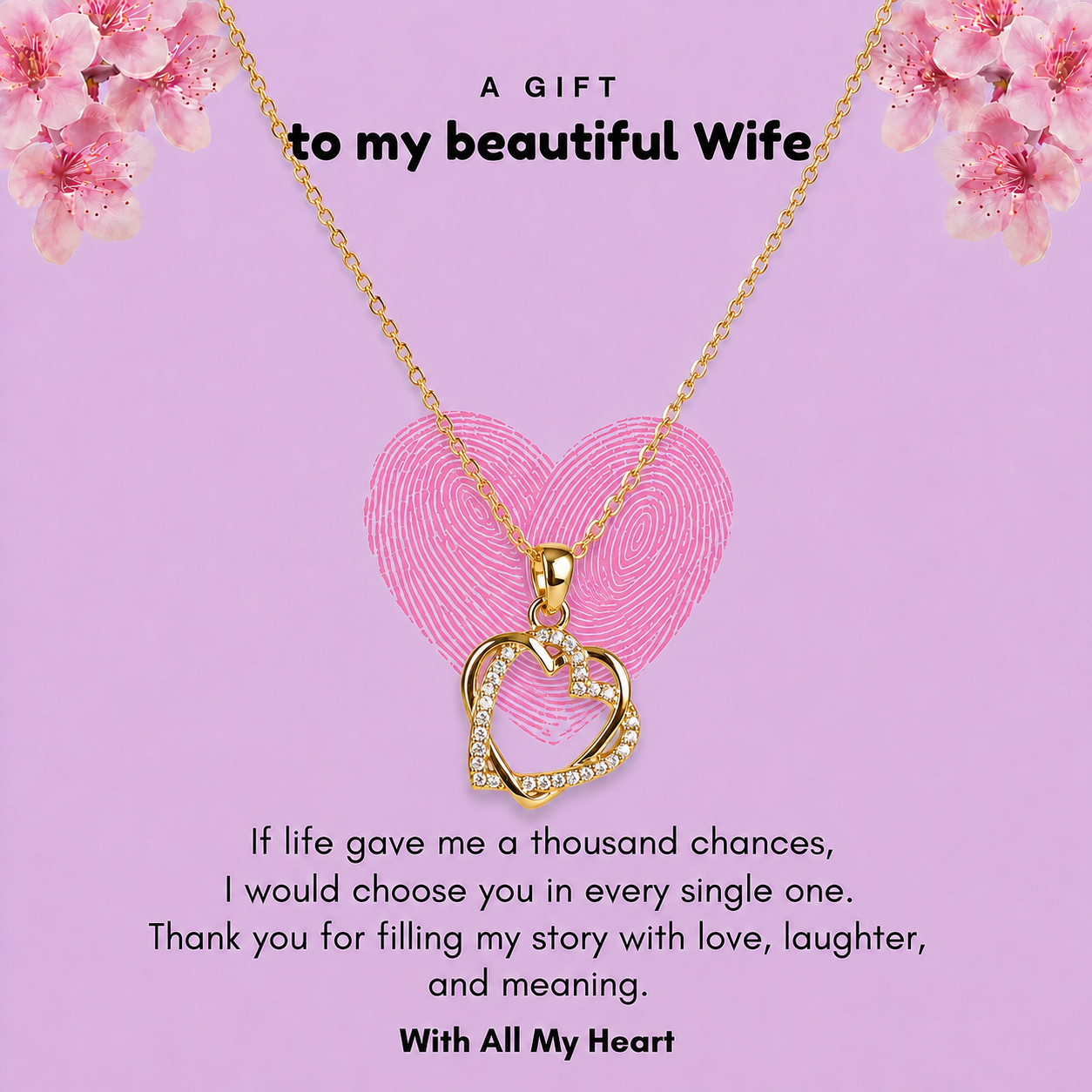 Gold-tone double heart pendant necklace for wife inside a standard gift box surrounded by holiday decor.