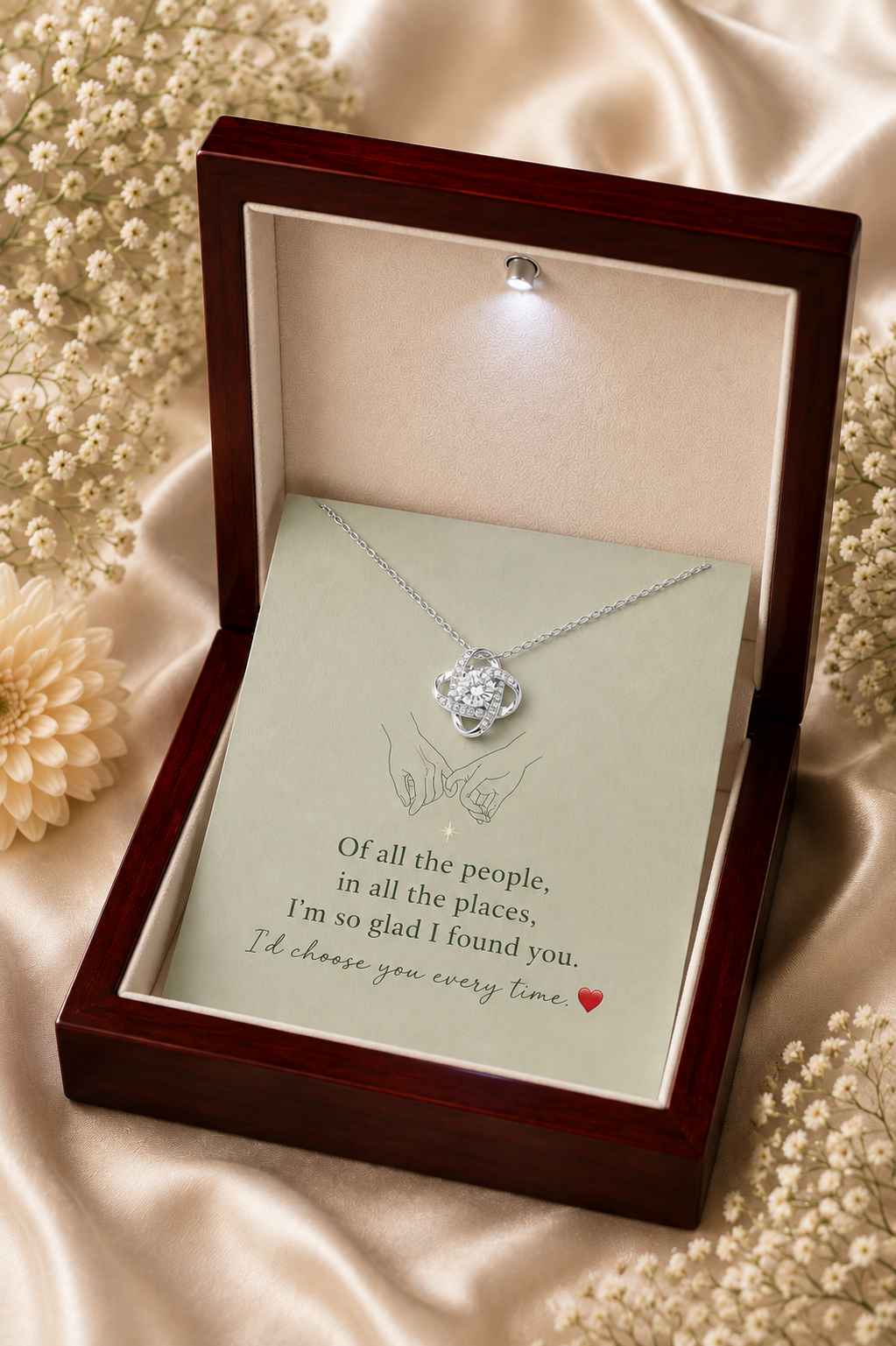 Silver-tone interlocking loop pendant necklace with crystal-style accents and heartfelt message card