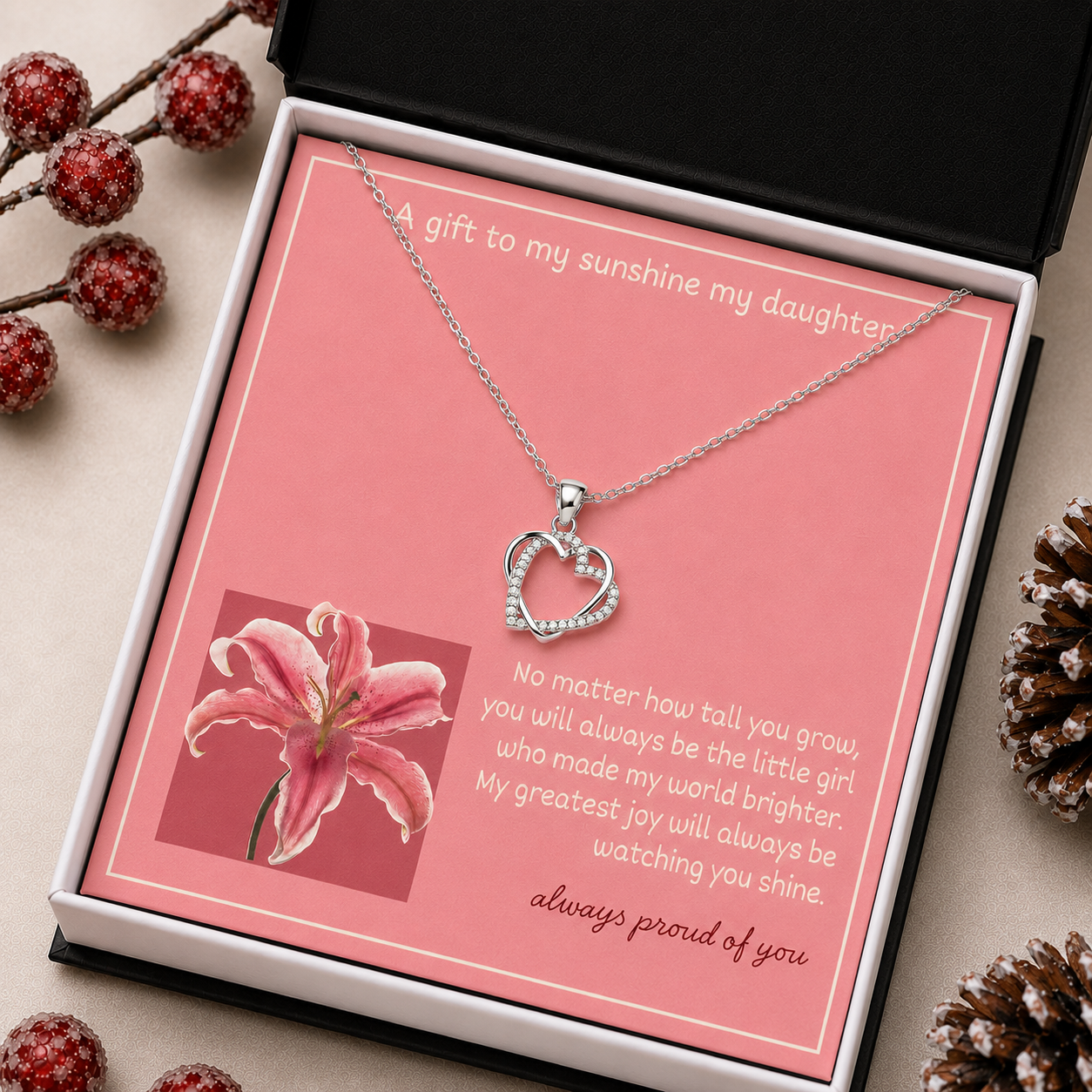 Silver-tone intertwined heart necklace with clear accents and pink daughter message card