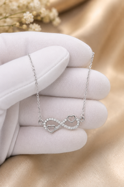 Silver-tone Mother infinity necklace displayed on red sentimental message card