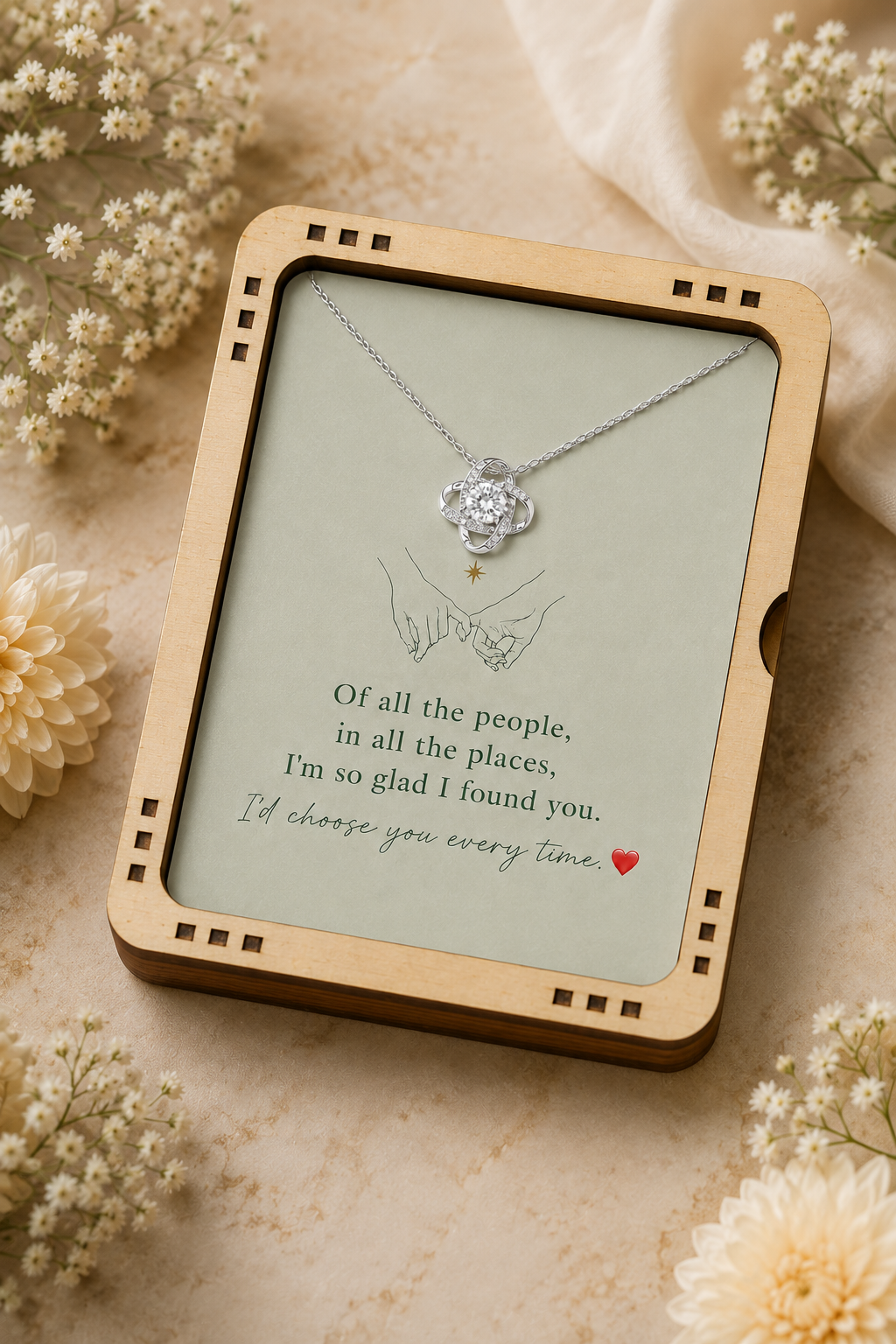 Silver-tone pendant necklace with clear stone centerpiece and printed romantic message card