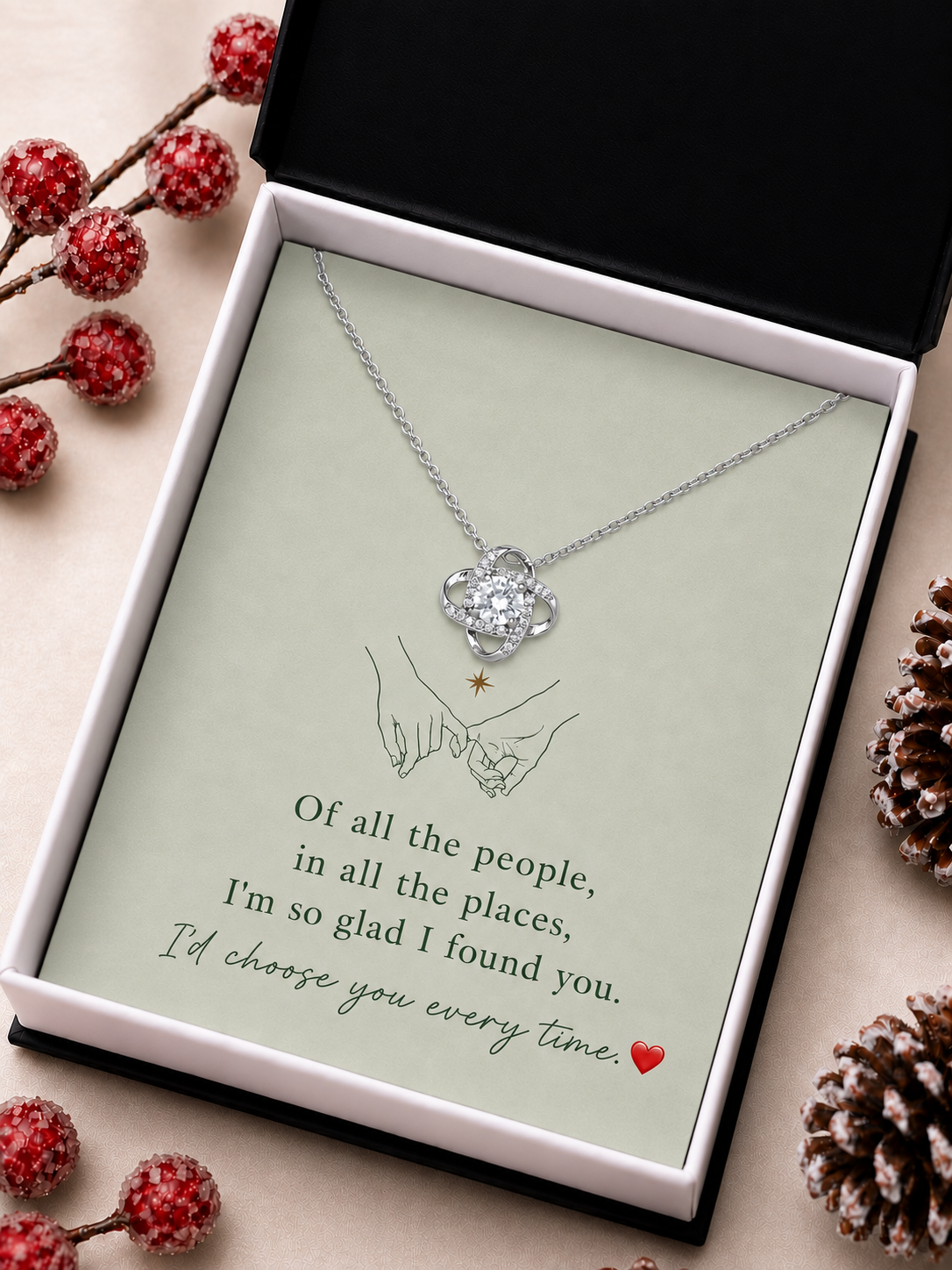 Silver-tone pendant necklace presented in an open black jewelry box with romantic message card