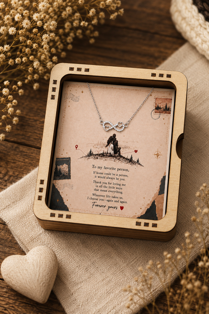 Silver-tone infinity pendant necklace with heart details and sparkling clear accents