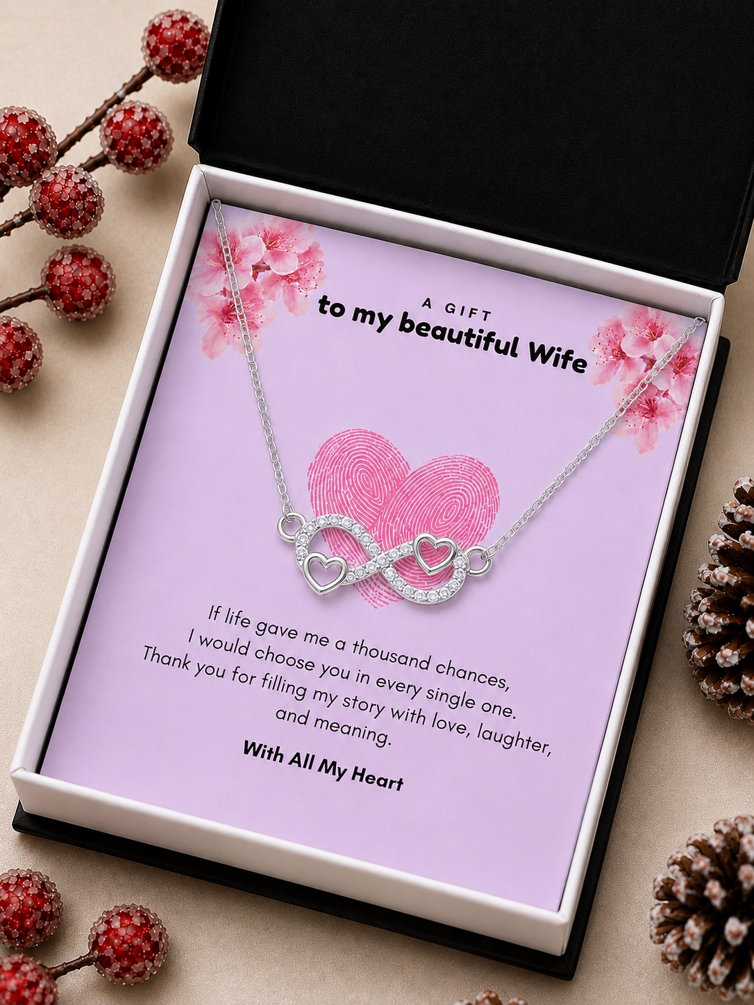 Silver-tone heart infinity pendant over romantic wife message card