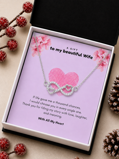 Silver-tone heart infinity pendant over romantic wife message card