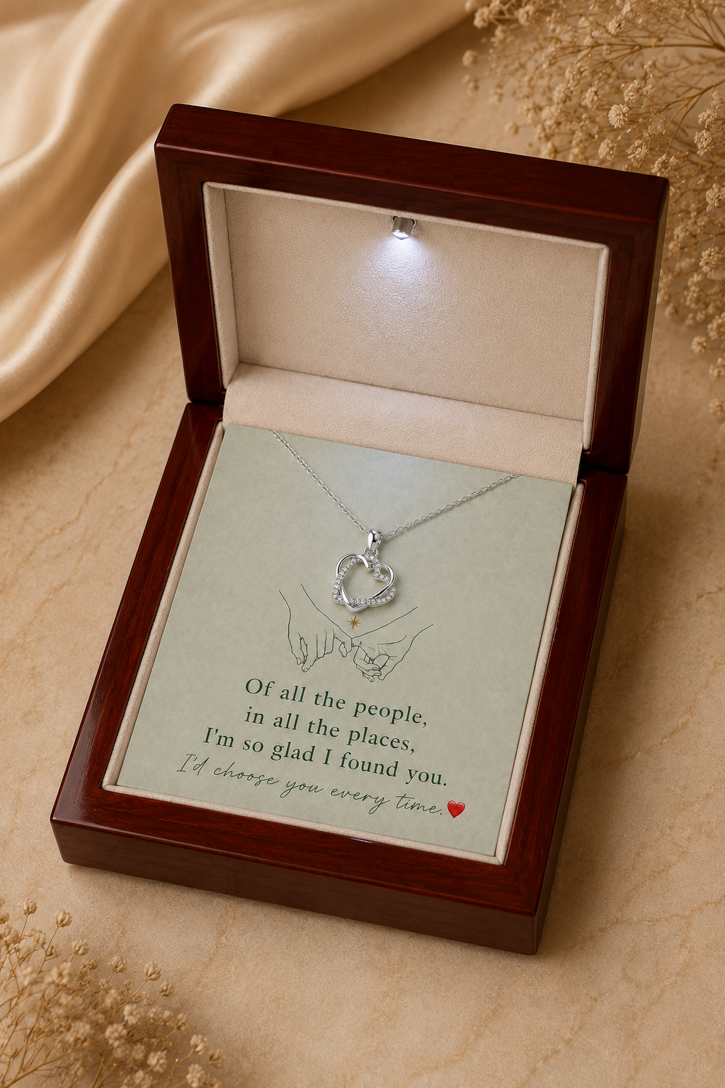 Silver-tone heart necklace with hands illustration and message