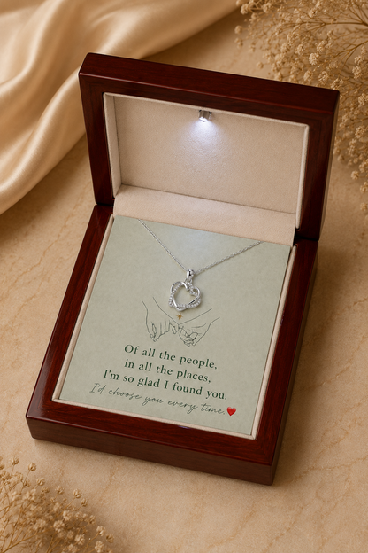 Silver-tone heart necklace with hands illustration and message