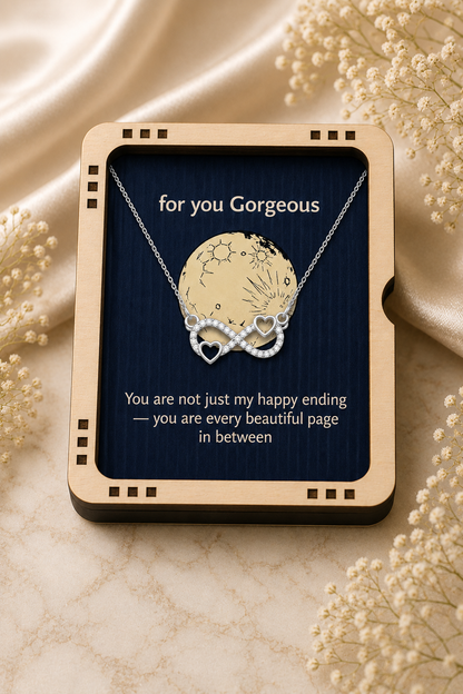 Silver-tone infinity necklace with celestial-inspired round pendant detail