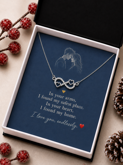 Silver-tone infinity necklace presented in decorative wooden box