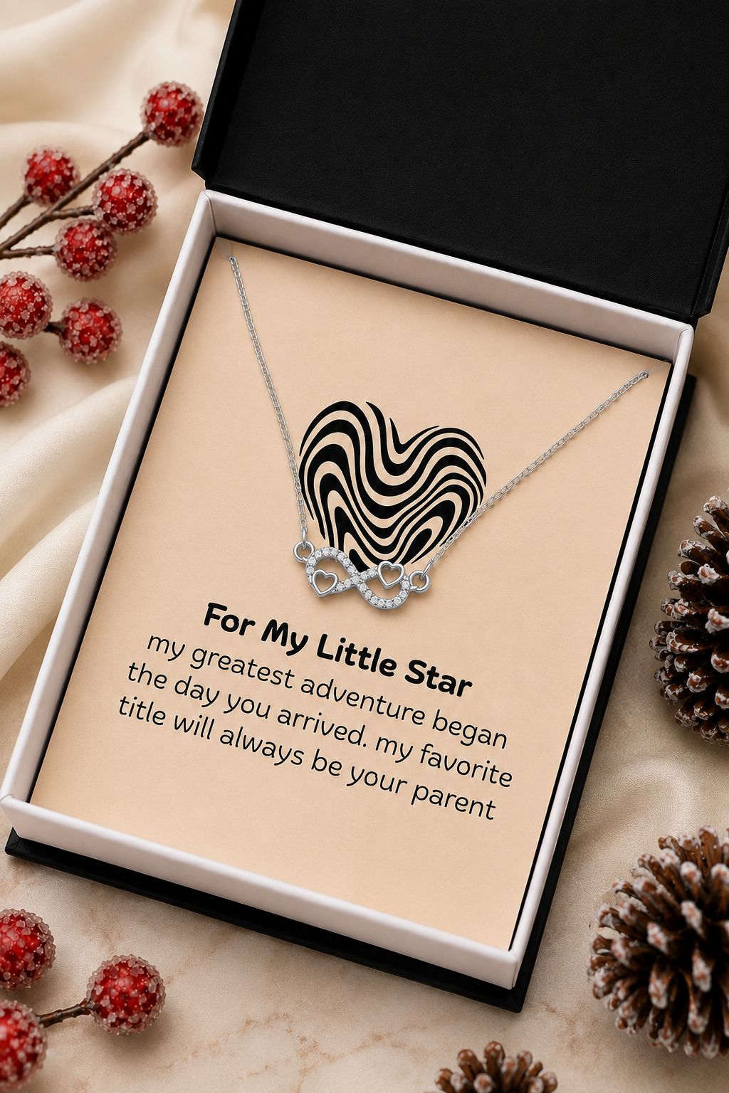 Silver-tone infinity heart necklace featuring clear crystal-style accents and an emotional parent-to-child message card