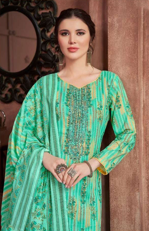 Elegant teal cotton dress with intricate embroidery for Eid