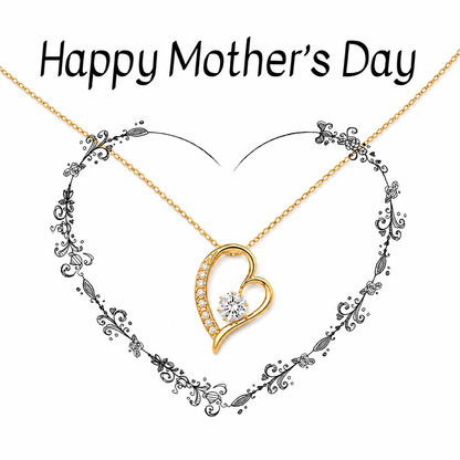 Gold heart-shaped pendant necklace with a small clear gemstone, displayed on a white background with the text 'Happy Mother's Day' above it.