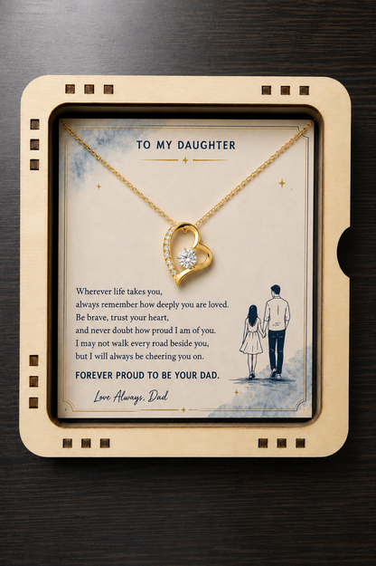 Gold-tone heart pendant necklace with a touching "To My Daughter" message card presented inside a handcrafted wooden slider gift box, creating a meaningful keepsake gift from father to daughter.