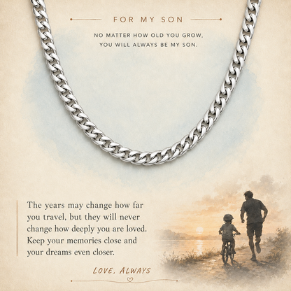 A silver curb chain necklace displayed on a warm beige memorial-style card with sentimental text and a small sunset scene in the lower right corner.