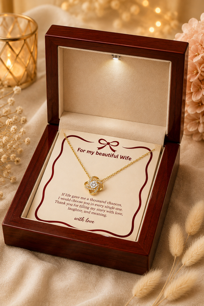 Wife gift necklace with interlocking-loop pendant and clear center stone